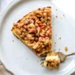 Cottage Cheese Cheesecake on a white plate with a fork on it.