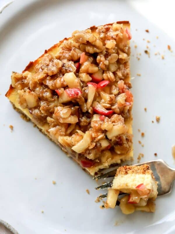 Cottage Cheese Cheesecake on a white plate with a fork on it.