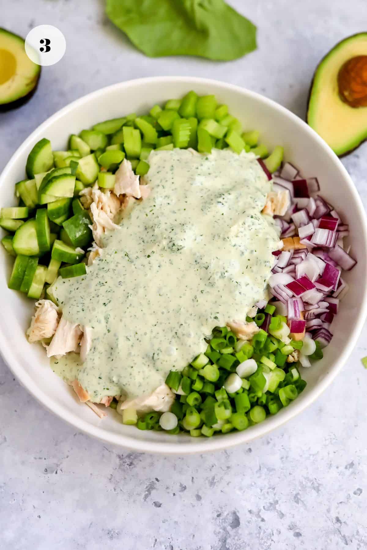 Big white bowl with ingredients in it about to be mixed up. 