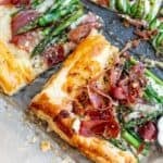 Asparagus puff pastry with prosciutto drizzled in warm garlic basil oil