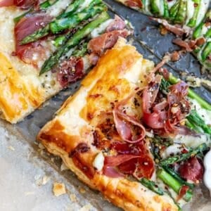 Asparagus puff pastry with prosciutto drizzled in warm garlic basil oil