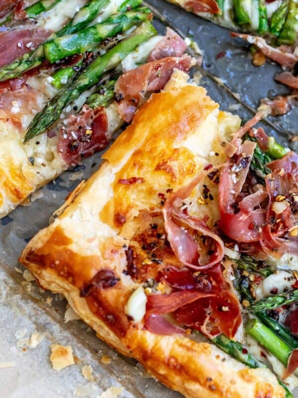 Asparagus puff pastry with prosciutto drizzled in warm garlic basil oil