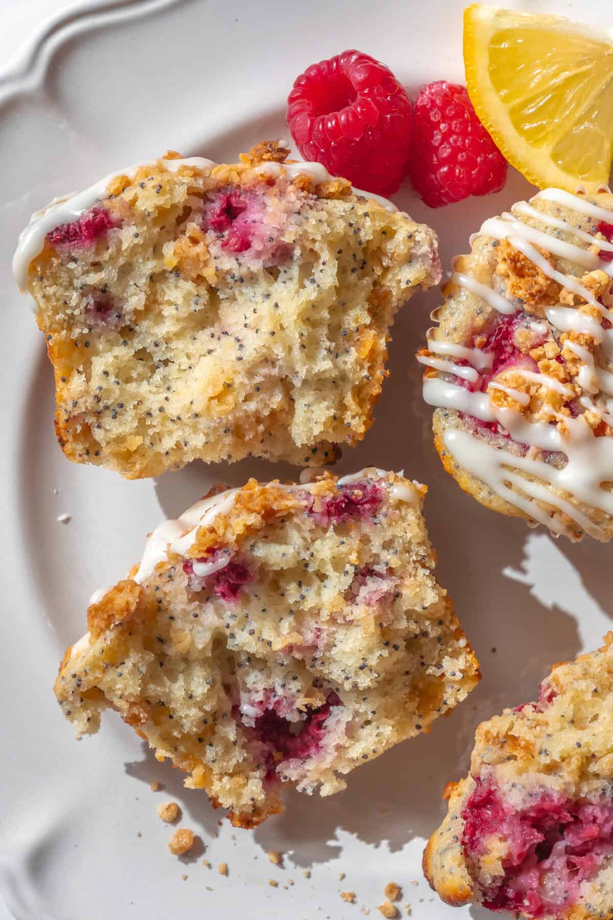 Fluffy lemon raspberry muffins with powdered sugar glaze