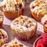 Fluffy lemon raspberry muffins with powdered sugar glaze