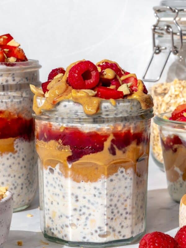 PBJ overnight oats and chia in a jar with peanut butter and strawberry jam