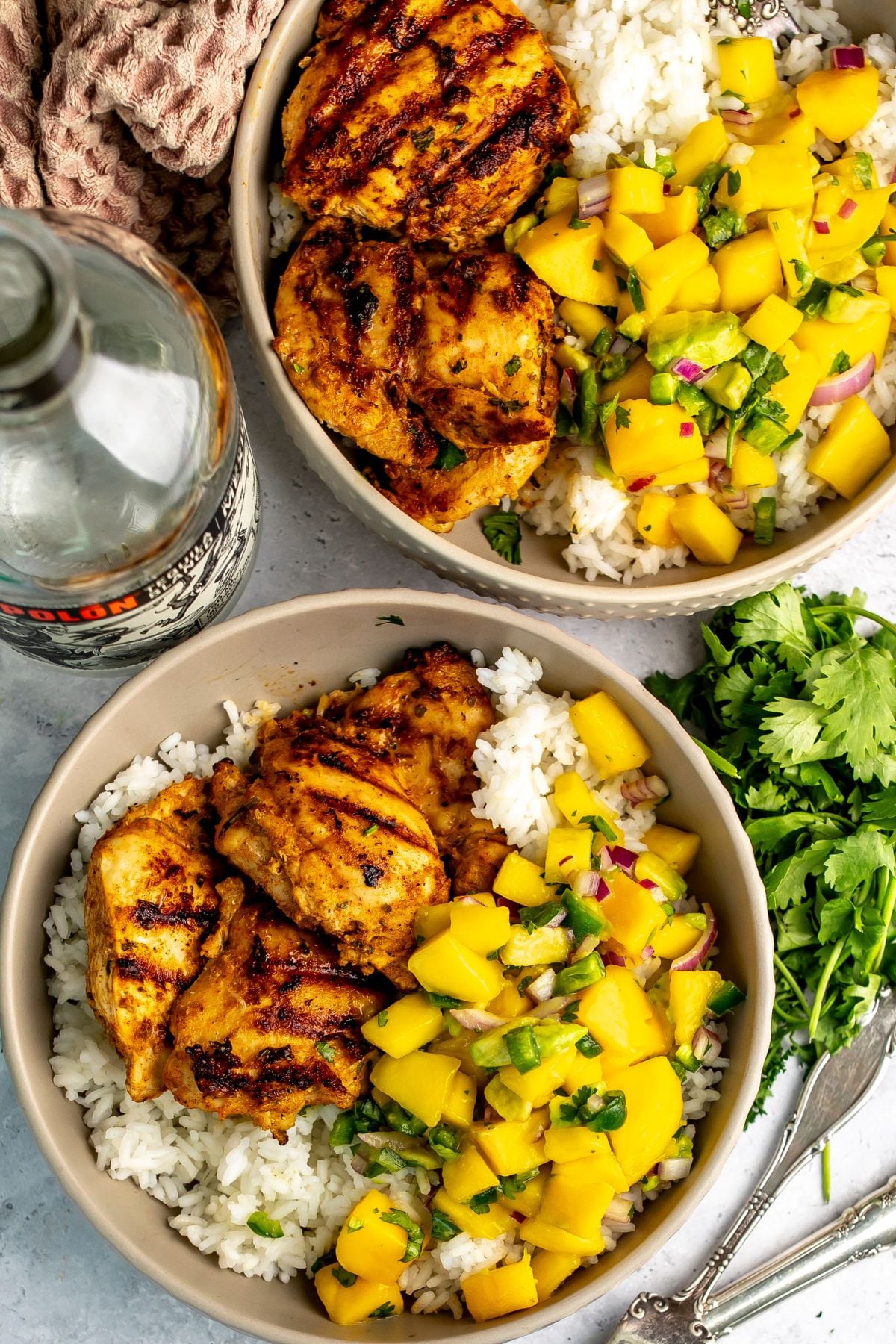 Tequila lime chicken served over rice and with mango salsa.