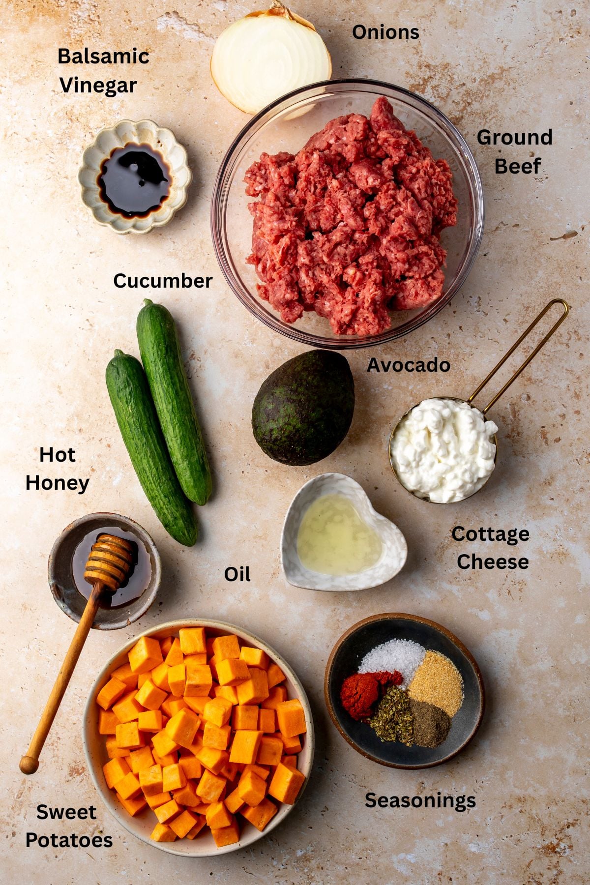 All of the ingredients for hot honey ground beef bowls in bowls on a countertop.