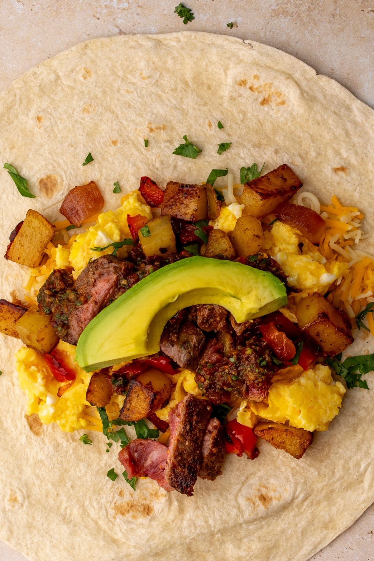 The filling ingredients on the tortilla before rolling.
