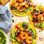 Shrimp tostadas on a piece of parchment paper for serving.