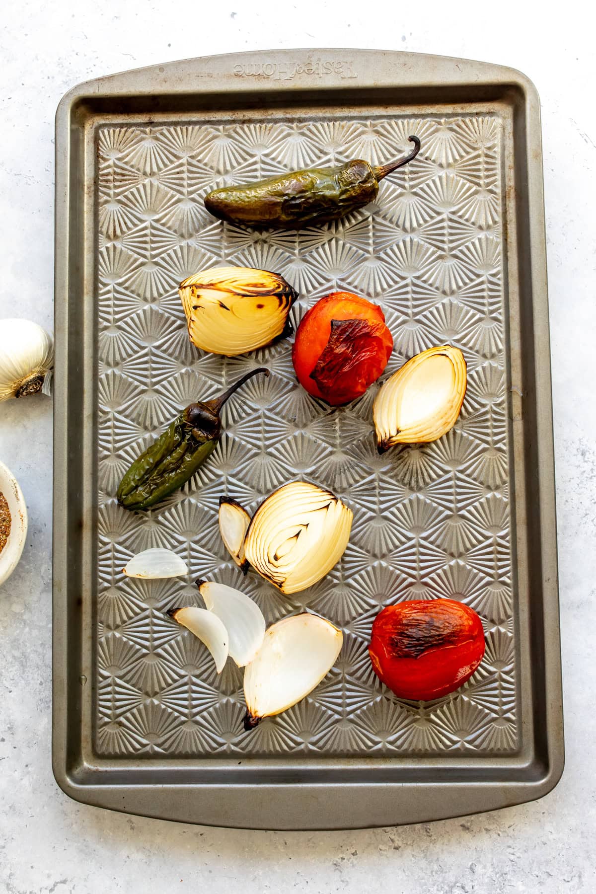 The roasted veggies on a sheet pan after roasting.