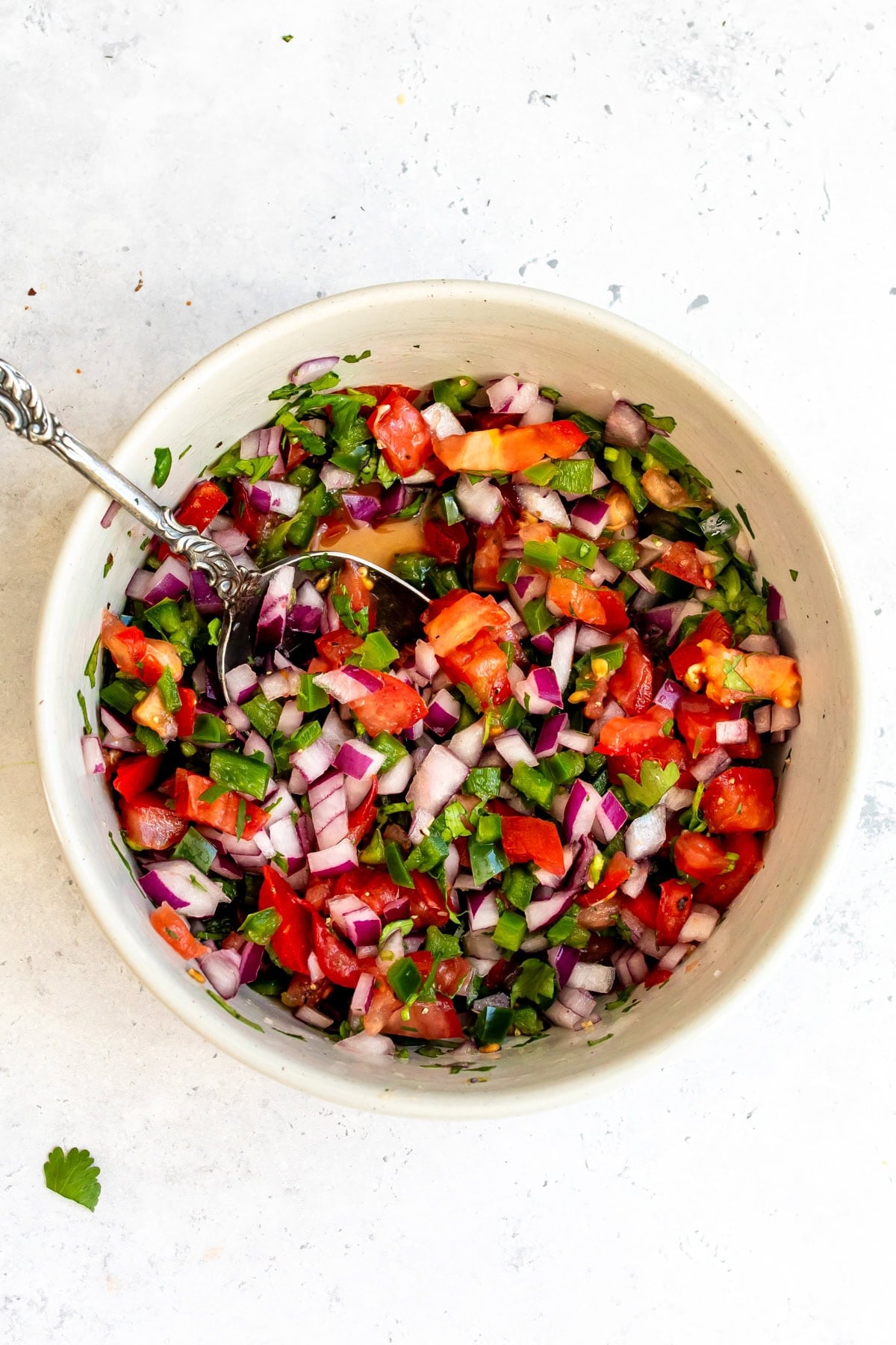 The pico in a white bowl on the countertop.