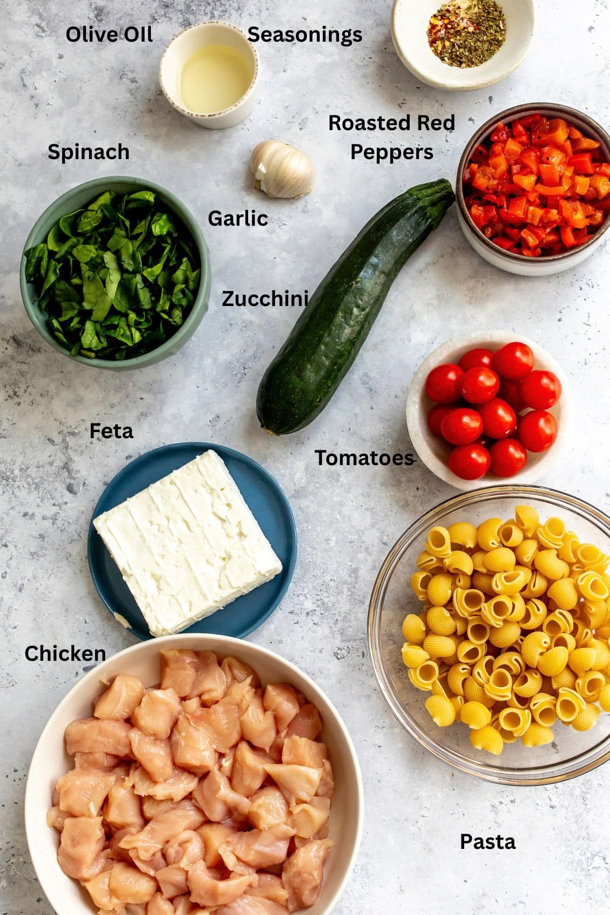 Ingredients laid out neatly on a counter in ceramic bowls.